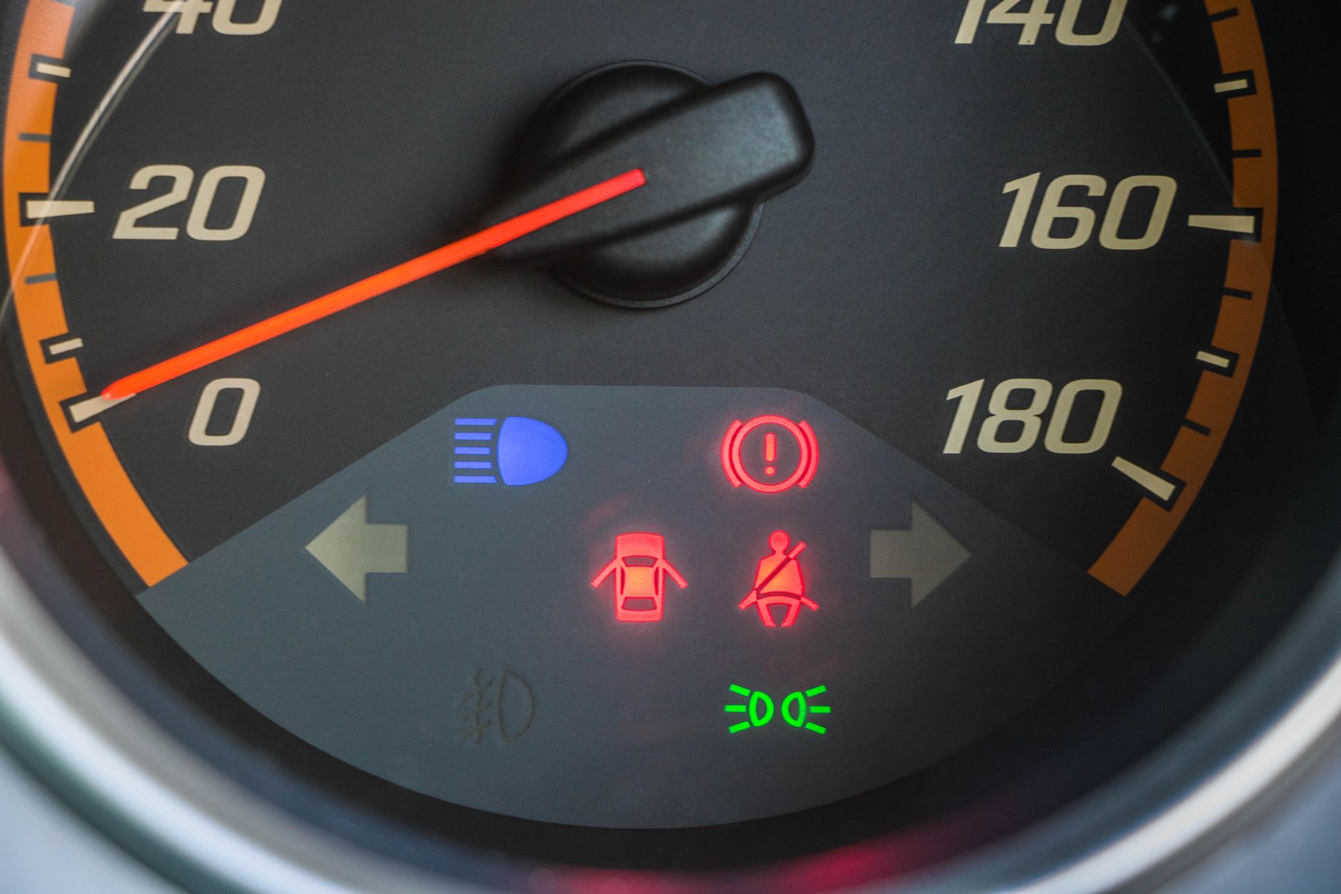 A car dashboard with instruments and warning lights, the kind of check a driver should be able to read before a lesson