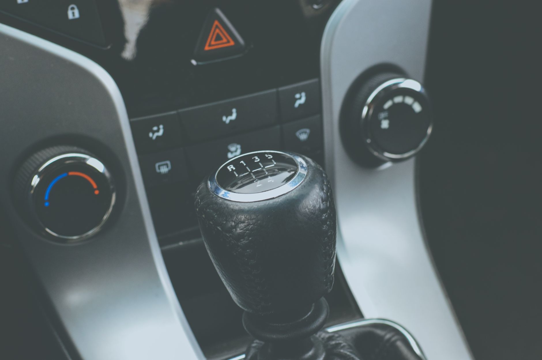 A manual gear stick and car console, the piece of equipment that separates a full licence from an automatic-only one