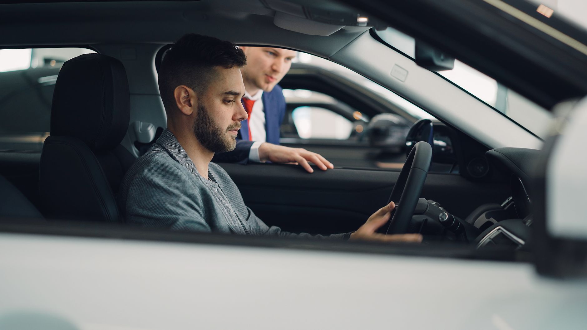 A driving examiner and candidate in a car, the setting for the practical stage of the Irish driving test